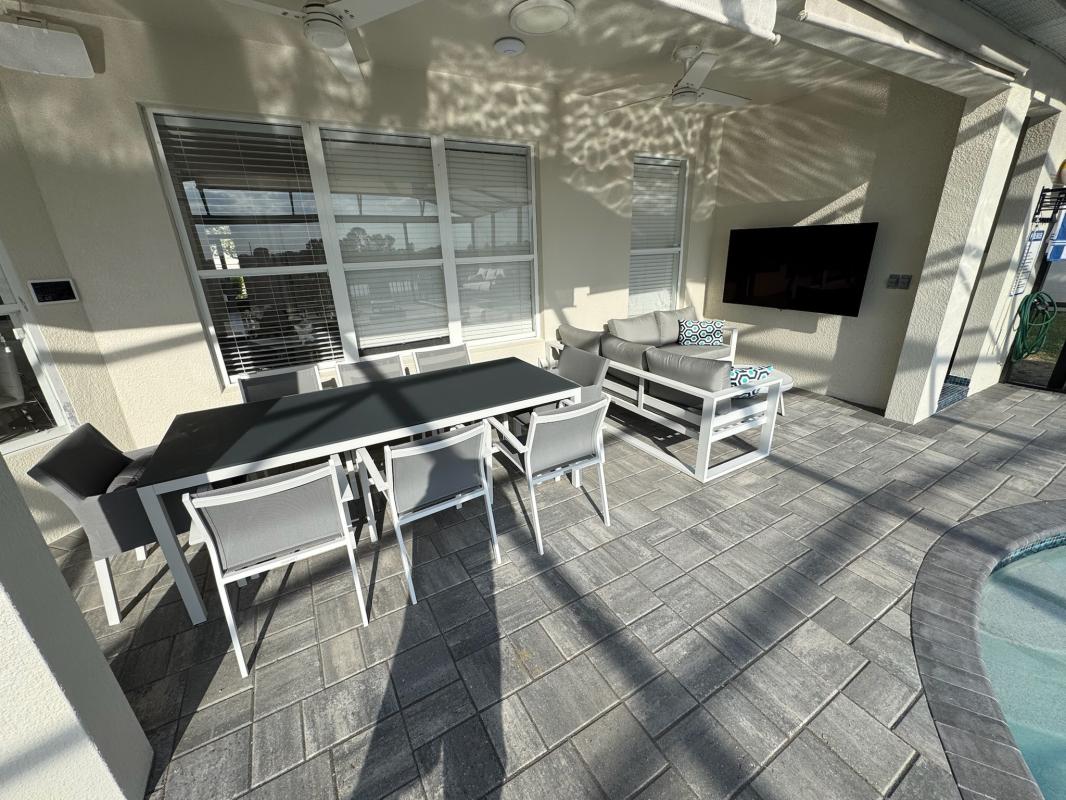 Outdoor dining and TV area