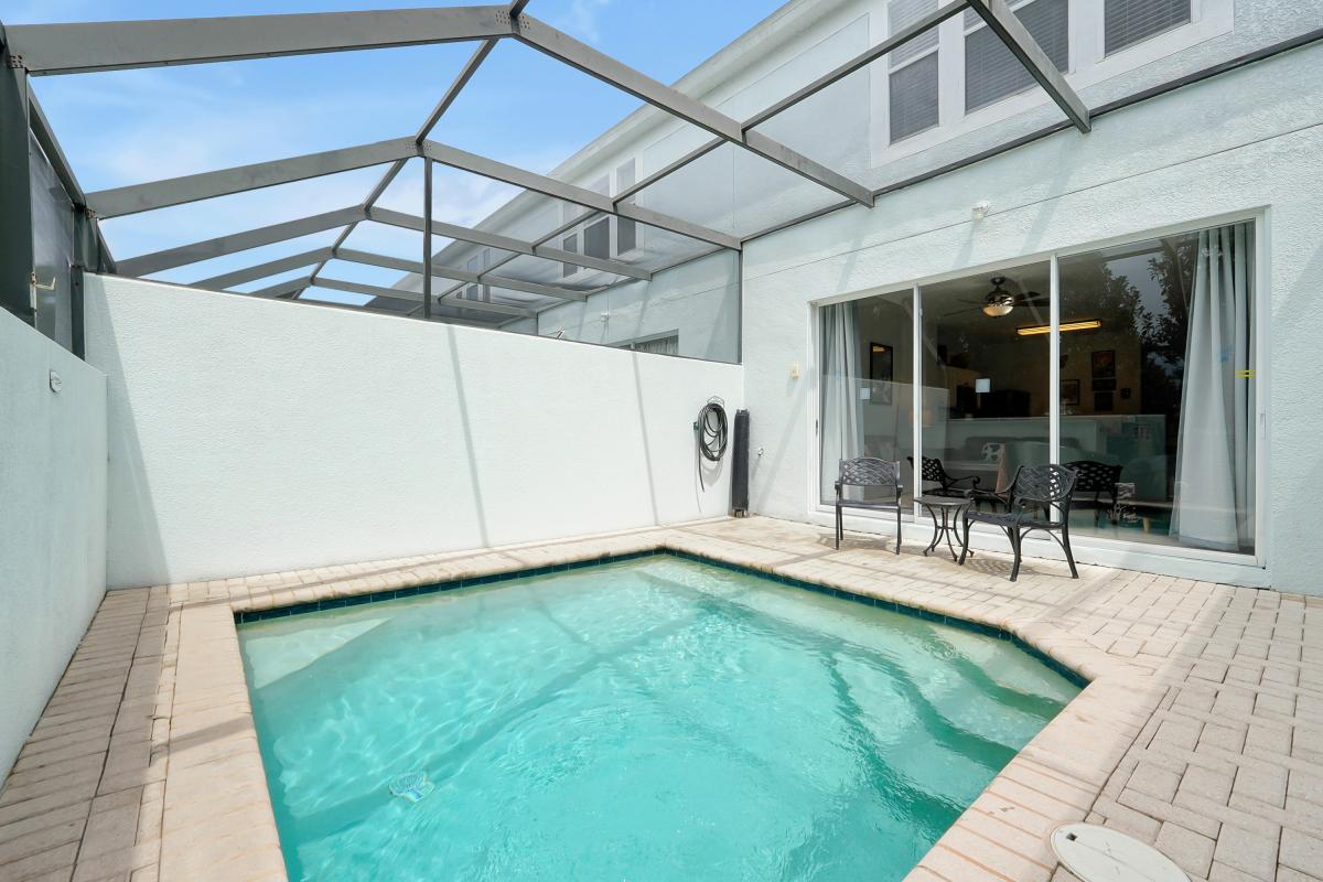 Pool safety fence is retracted for the photo.