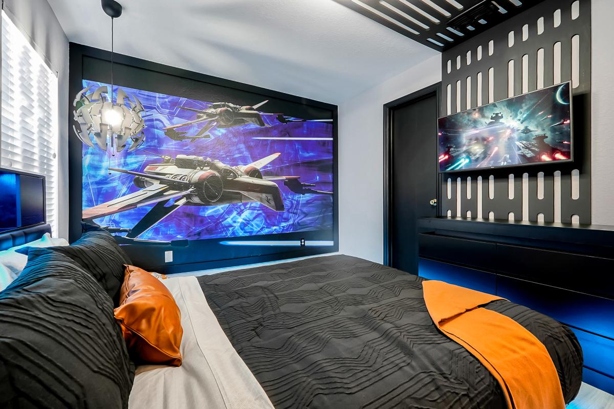 Cinematic sci-fi retreat with platform bed, immersive space mural, LED glow, and galactic details. 